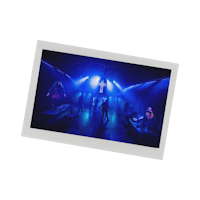 a photo of people on stage in a dark room