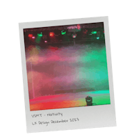 a photo of a stage with lights and smoke