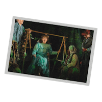 a group of people sitting on a swing